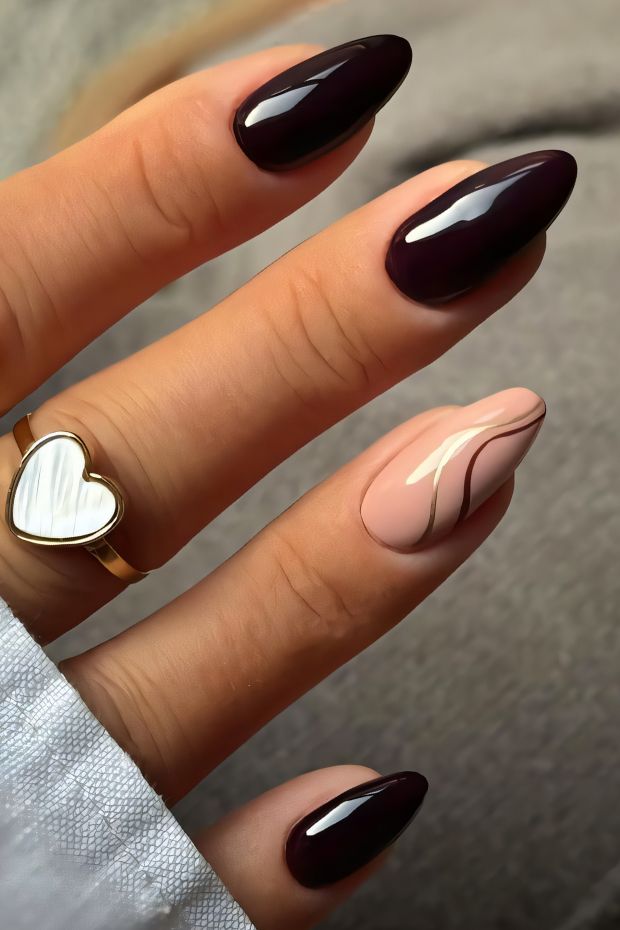Stylish brown nail design featuring deep brown shades and a nude swirl, perfect for elegant nail art inspiration.