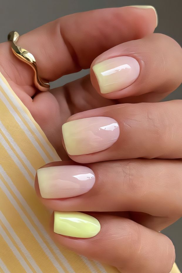 Trendy ombre pastel nail design with a glossy finish highlighting soft colors and chic style.