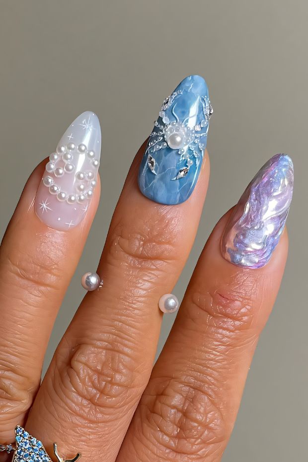 Elegant birthday nail art with blue hues, pearl accents, and intricate designs perfect for celebrations.