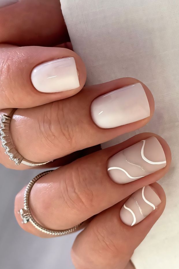 Chic white short nails with minimalist curvy white lines, perfect for a modern and elegant style.