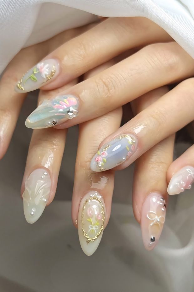 32 Creative Acrylic Nail Ideas You’ll Want to Try This Season 29 Pastel floral acrylic nails with intricate designs and embellishments showcasing a charming and whimsical nail art style.