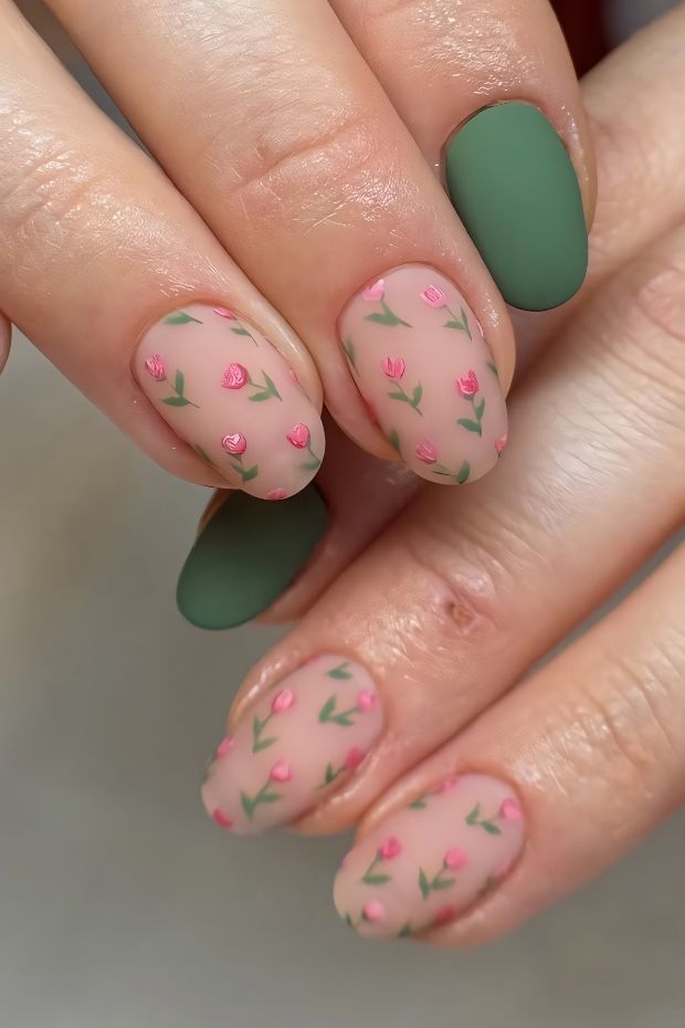 Matte nail design featuring floral patterns in pastel pink and green for a chic, elegant look.