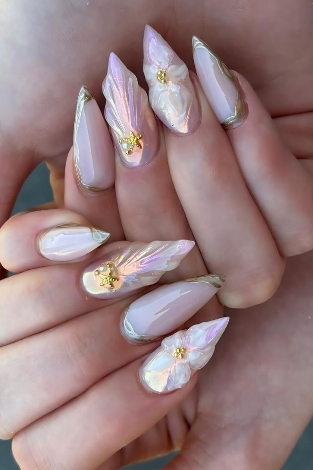 32 Creative Acrylic Nail Ideas You’ll Want to Try This Season 8 Elegant acrylic nails featuring floral accents and iridescent finish in soft pink and beige tones.