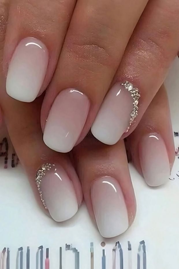 32 Creative Acrylic Nail Ideas You’ll Want to Try This Season 11 Elegant ombre acrylic nails in nude and white with rhinestone accents for a stylish nail art design.