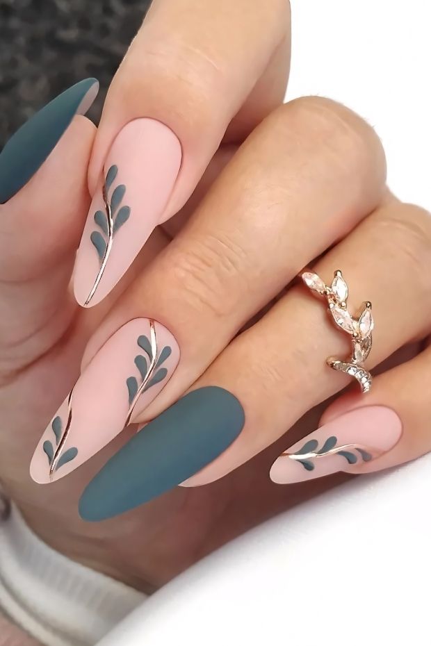 Elegant matte nail design with green and pink shades featuring delicate leaf patterns for a stylish look.