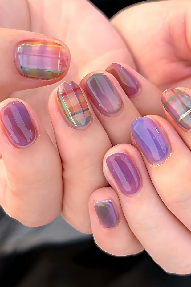 32 Creative Acrylic Nail Ideas You’ll Want to Try This Season 24 Trendy acrylic nails with purple shades and colorful plaid designs, perfect for stylish nail art enthusiasts.