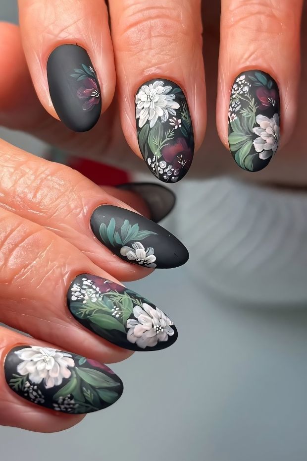 Matte nail design featuring floral patterns and greenery, perfect for a chic and nature-inspired look.