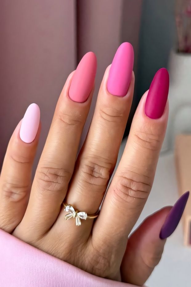 Matte pink nail designs featuring various shades and a chic gradient effect for a stylish appearance.