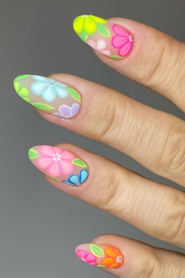 Vibrant matte nail design with colorful floral patterns in pastel shades for a cheerful spring look.