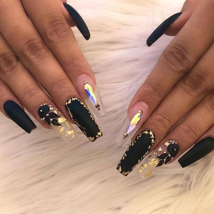 These creative designs for black acrylic nails are perfect for those who want something fun, simple, and classic. With so many beautiful nail artists out there these days, it can be hard to decide which style to go with. If you're looking for a design that will work well with any outfit or occasion, then look no further than this post! #blacknails #blacknailart #blacknaildesigns #blackacrylicnails